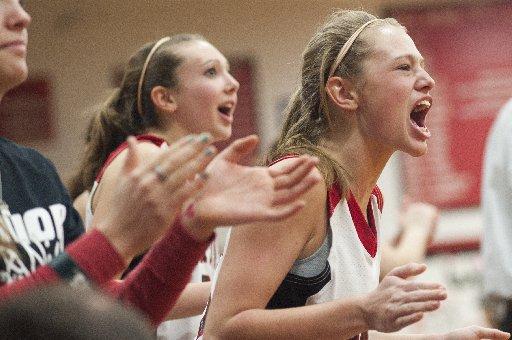 Northwest's Taylor Roberts cheers on her teammates as they gain a lead over