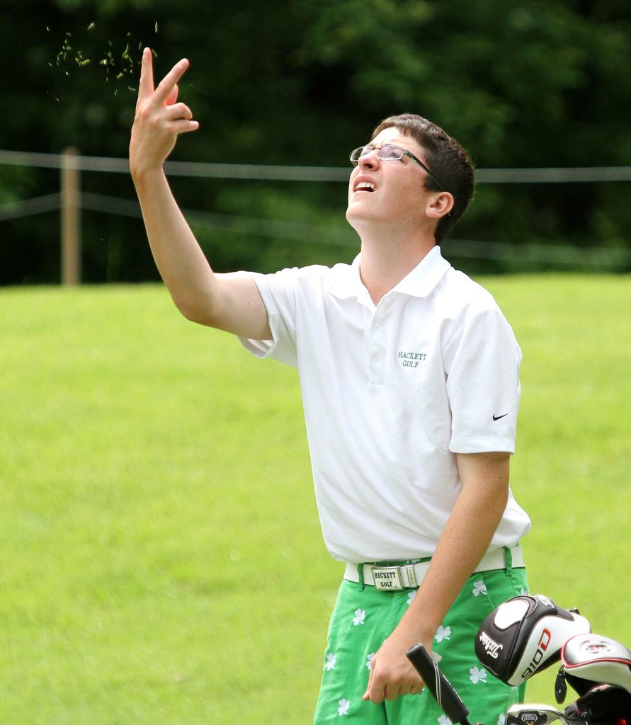 Golfer Testing The Wind