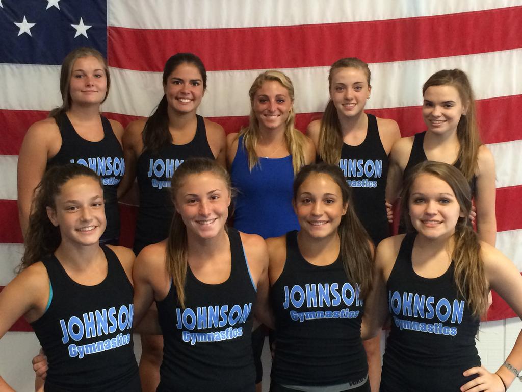 Ginástica: treinador Ferdinandi e ginasta olhando para despertar equipe Johnson em 2014