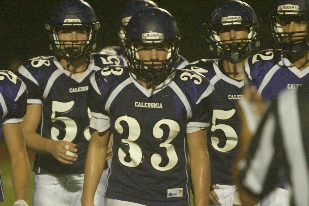 Caledonia junior Caleb Bronkema calls the signals on both lines of scrimmage